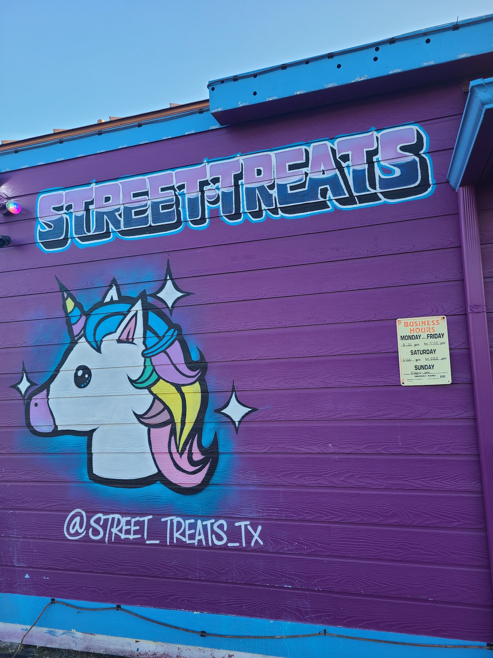 Street Treats storefront with hand-painted unicorn mural